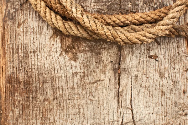 Ship rope and weathered wood background — Stock Photo, Image