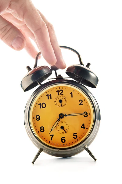 Hand knocking down vintage clock — Stock Photo, Image