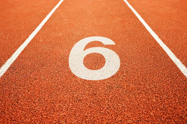 Number six on running track — Stock Photo, Image