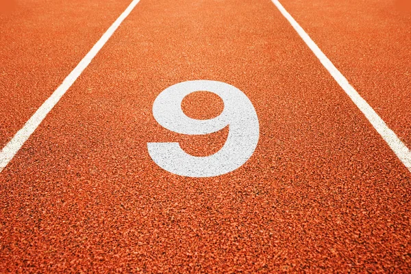 Number nine on running track — Stock Photo, Image