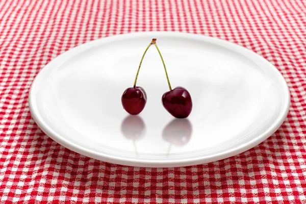 Cherry on the plate — Stock Photo, Image