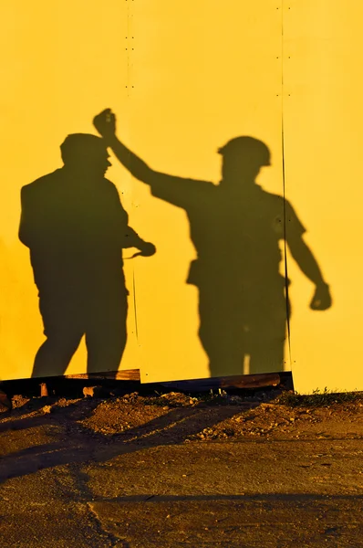 Schatten der Bauarbeiter — Stockfoto