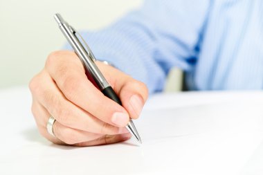 Businessman signing contract clipart