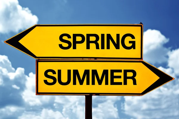 Spring or summer opposite signs — Stock Photo, Image