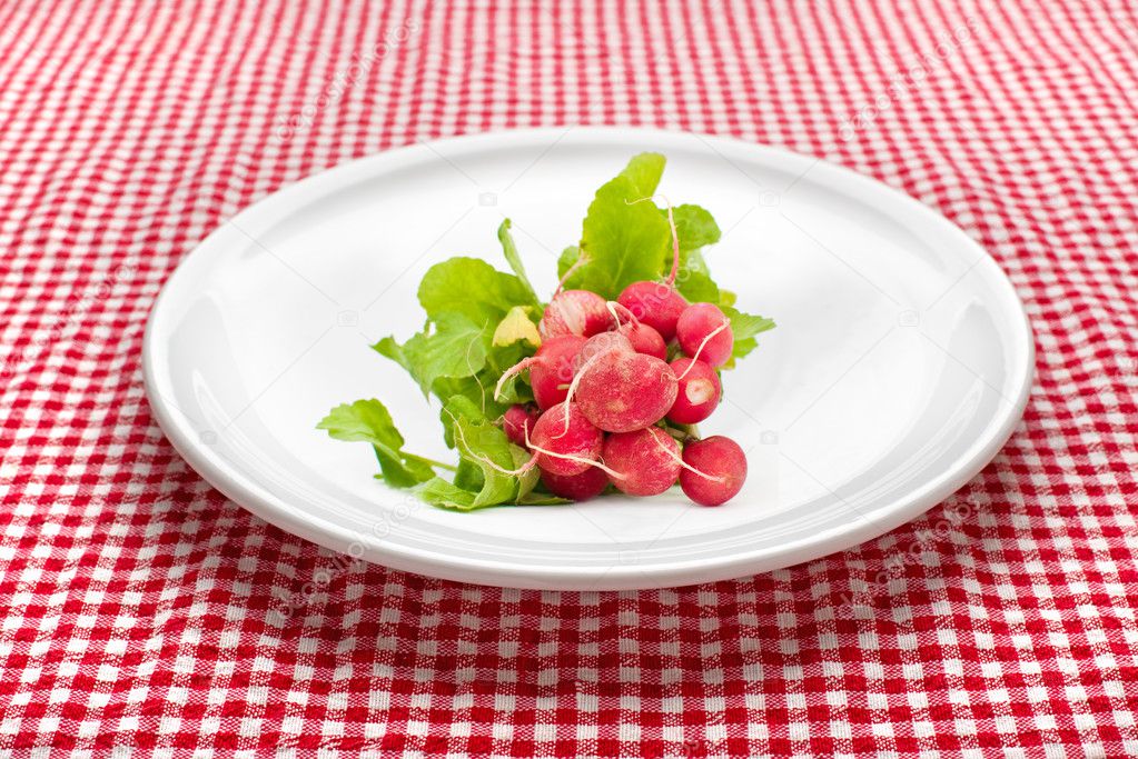 Red radishes on plate