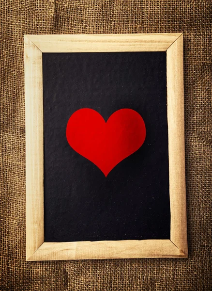 Heart on black board — Stock Photo, Image