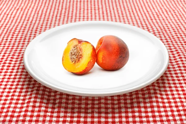 Nectarine on plate — Stock Photo, Image