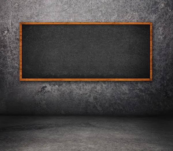 Concrete room with chalkboard — Stock Photo, Image