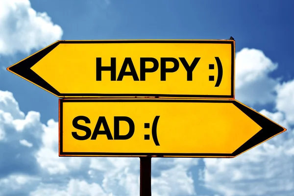 Šťastný nebo smutný, naproti známky — Stock fotografie