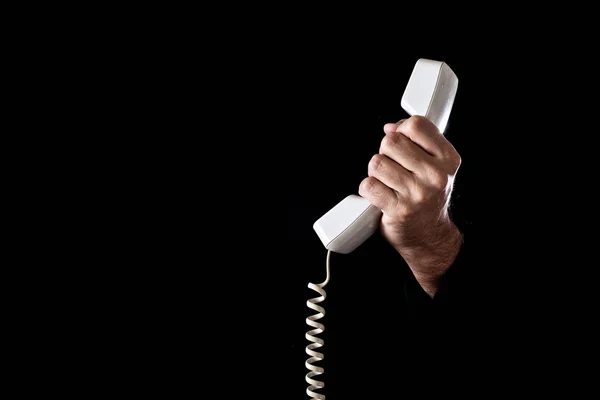 Mão segurando receptor de telefone — Fotografia de Stock