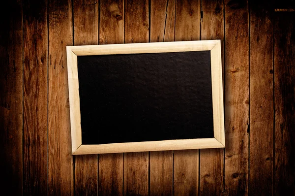 Blan message board on wooden background — Stock Photo, Image