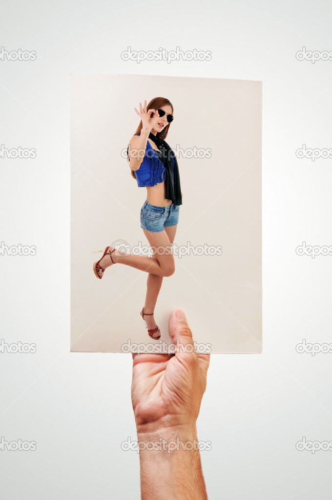 Man holding picture of sexy woman