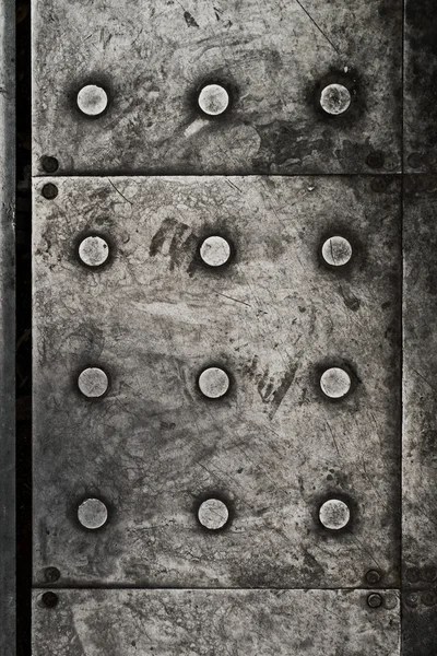 Black grunge metal plate as background — Stock Photo, Image