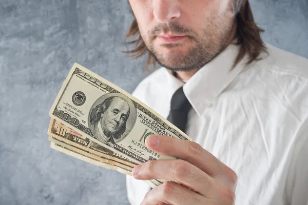 Businessman holding United states dollars — Stock Photo, Image