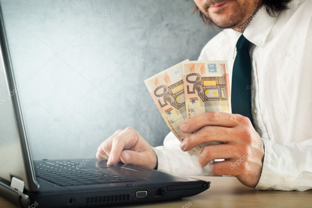 Making money online, businessman with laptop computer