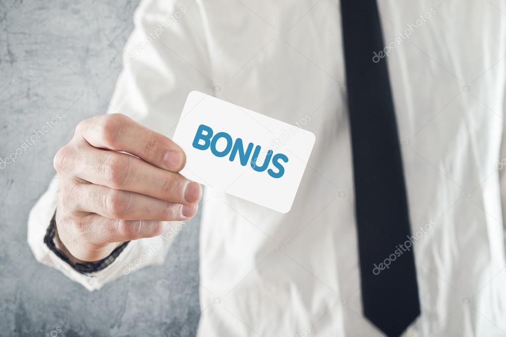 Businessman holding Bonus card.