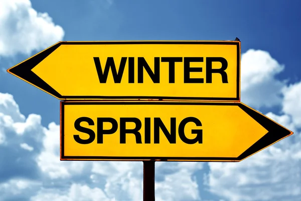 Winter or spring opposite signs — Stock Photo, Image
