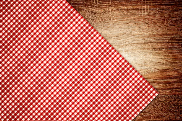 Table cloth, kitchen napkin on wooden background. — Stock Photo, Image