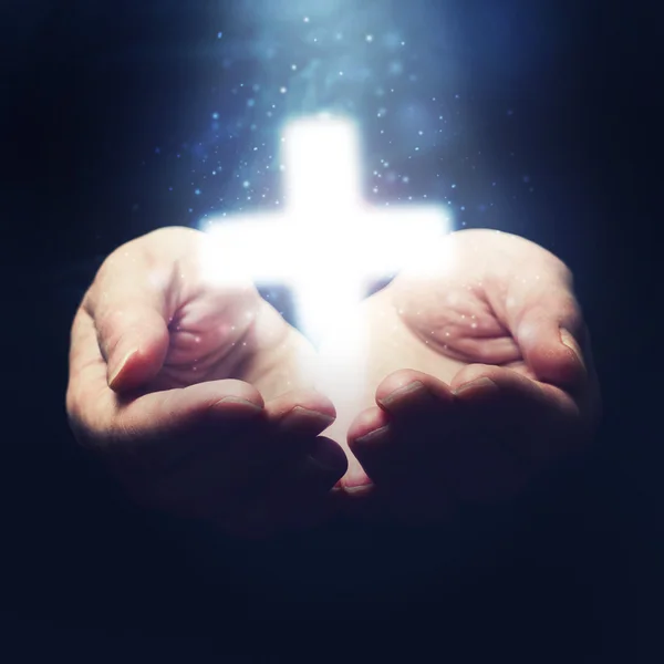 Open hands holding Christianity cross — Stock Photo, Image