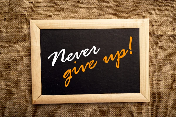 Never give up, motivational message — Stock Photo, Image