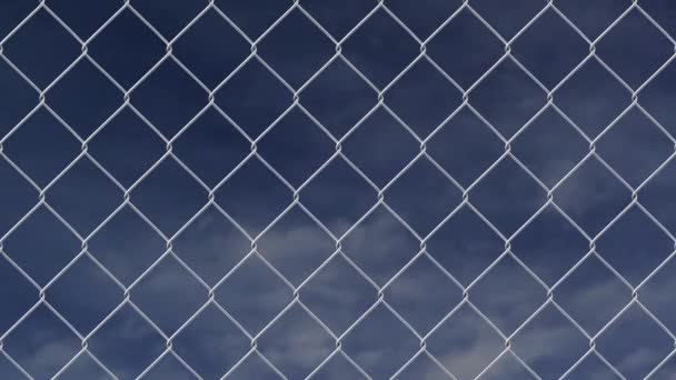 Wire fence against cloudy sky timelapse — Stock Video