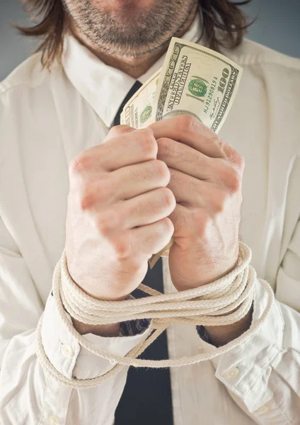 Businessman with hands tied in ropes — Stock Photo, Image