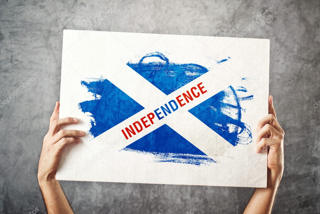 SCotland Independence flag. Man holding banner with Scotish inde