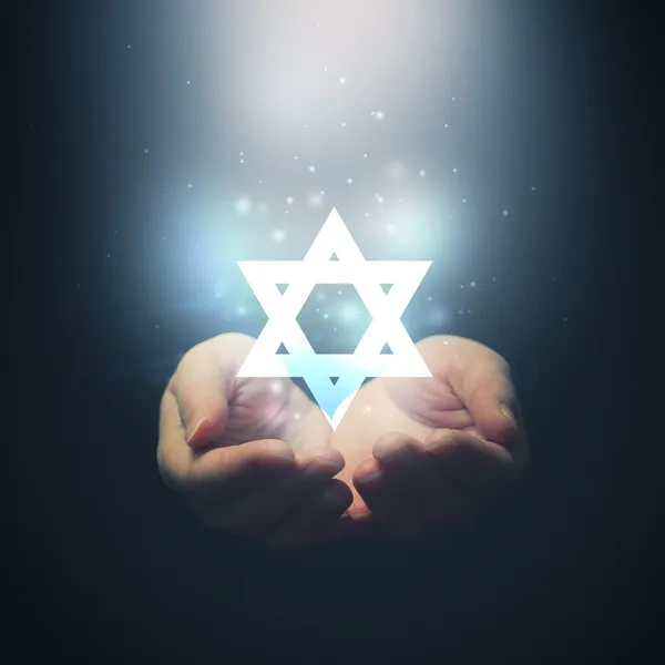 Female hands opening to light and David's star. — Stock Photo, Image