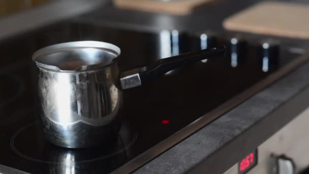 Coffee pot on cooking plate with boiling water in — Stock Video