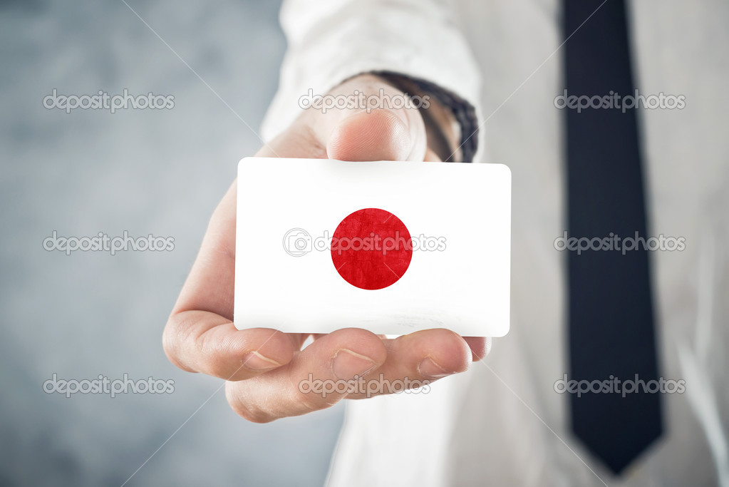 Japanese Businessman holding business card with Japan Flag