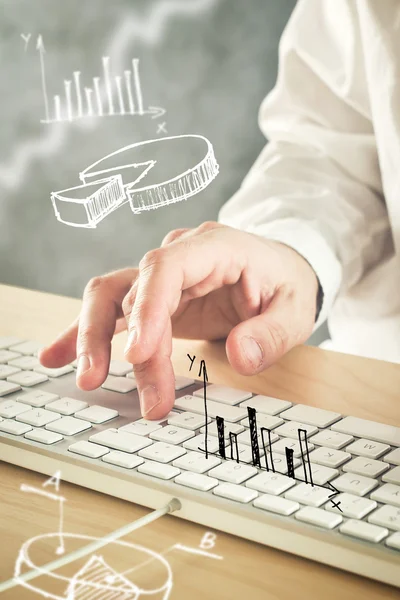 Businessman typing computer keyboard with pie chart and other in — Stock Photo, Image