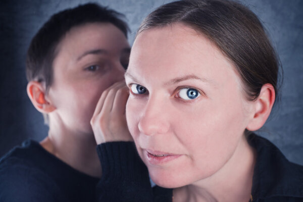 Two women gossiping