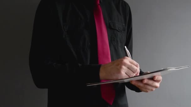 Businessman signing project documentation. Close up shot with selective focus. Business situation. — Stock Video