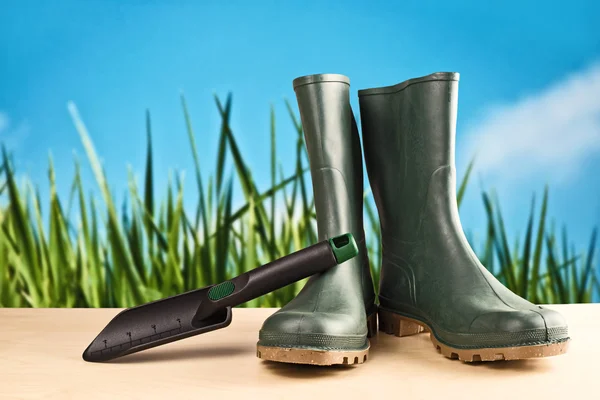 Green rubber boots for garden work — Stock Photo, Image