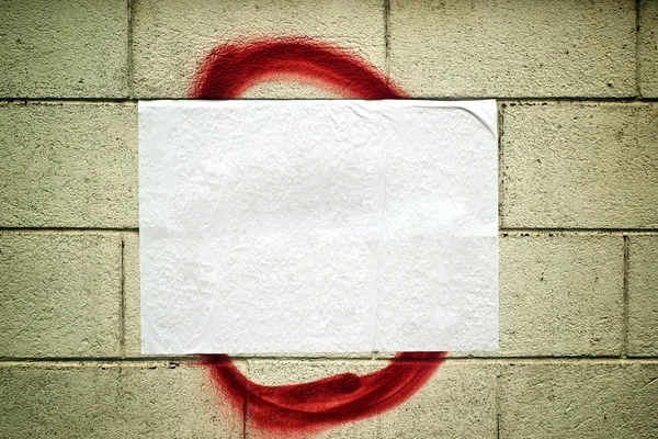 Blank white poster on grunge wall — Stock Photo, Image