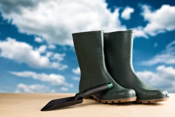 Green rubber boots for garden work — Stock Photo, Image