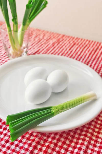 Boiled chicken eggs and fresh spring onion for breakfast — Stock Photo, Image