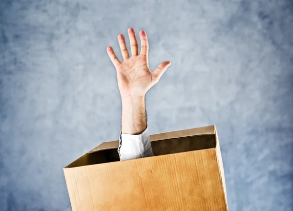 Male hand reaching out from the box — Stock Photo, Image