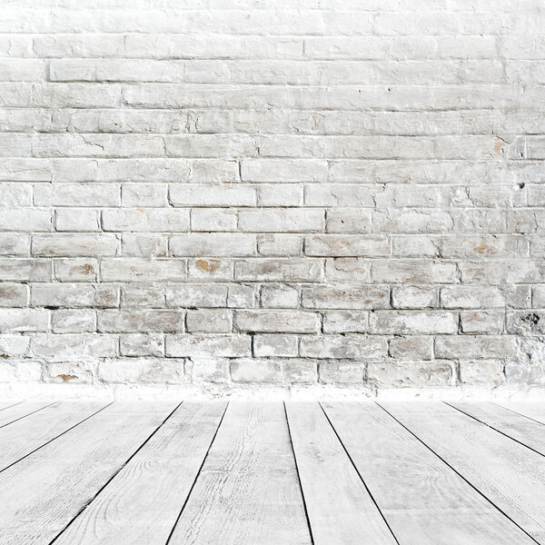 Room interior with white brick wall and wood floor