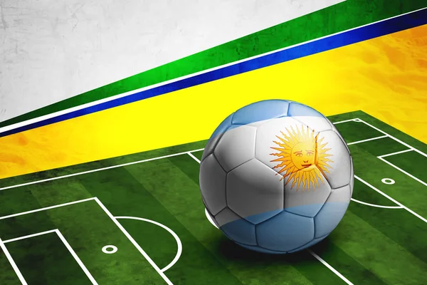 Soccer ball with Argentina flag on pitch — Stock Photo, Image