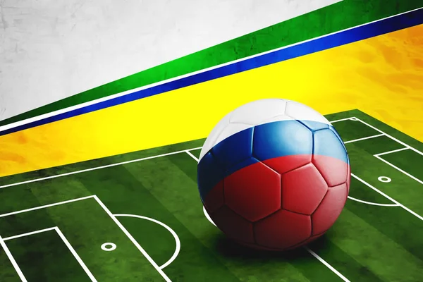 Soccer ball with Russia flag on pitch — Stock Photo, Image