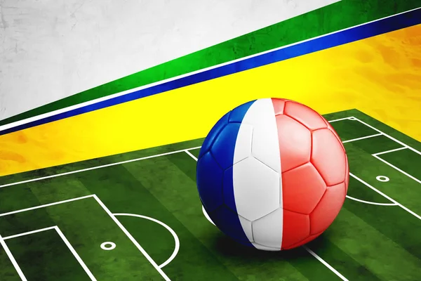 Pallone da calcio con bandiera francese in campo — Foto Stock