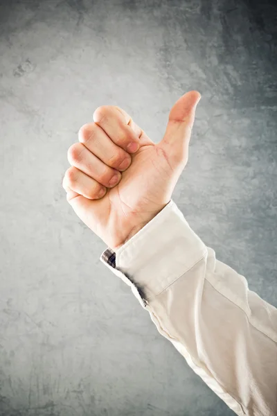 Businessman showing OK sign with his thumb up — Stock Photo, Image