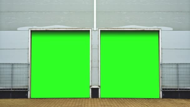 Industrial Unit with roller shutter doors. Warehouse storage doors with green screen mate background are closing. 1920x1080, 1080p, hd, high definition footage. — Stock Video