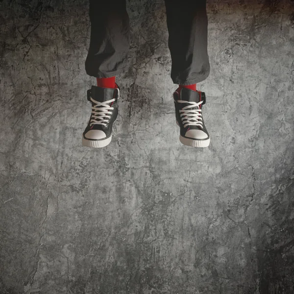 Young man in sneakers jumping — Stock Photo, Image