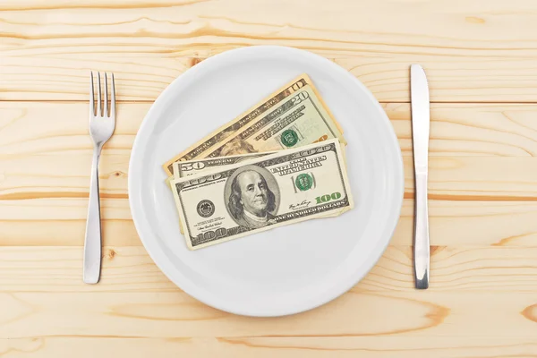Доларів США служив на плиті повечеряти — стокове фото