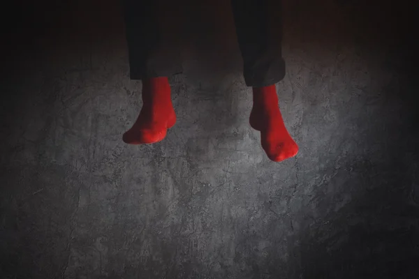 Young man in red socks jumping high in the air — Stock Photo, Image