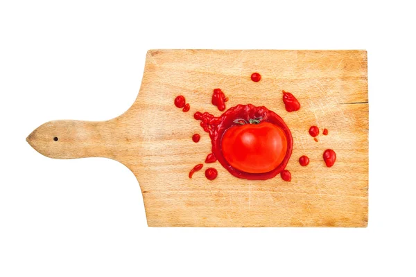 Tomato and ketchup on wooden board — Stock Photo, Image