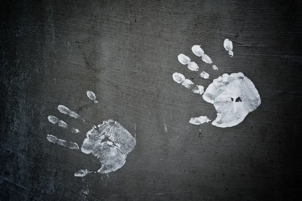 Hand wordt afgedrukt op grunge muur — Stockfoto