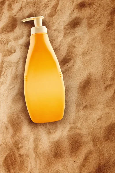 Bottle of Sunbath oil or sunscreen — Stock Photo, Image